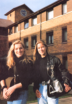 Two female students posed in front of hall of residence