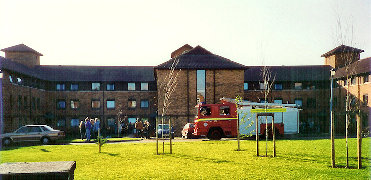 Fire engine and students outside a building