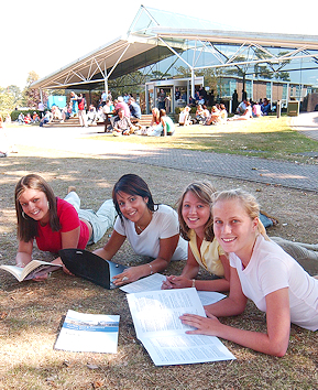 Four female students on the grass