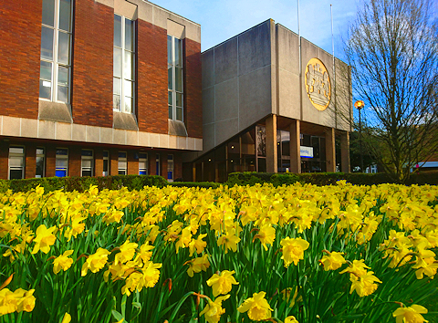 Holdenby / Main Building with daffodils in the foreground