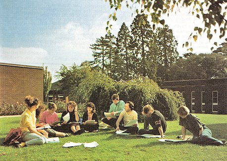 Students discuss ideas in the sunshine behind the Holdenby building