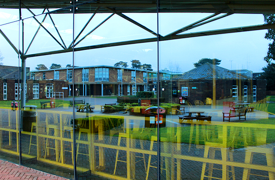 Buildings reflected in glass