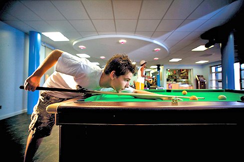 Male student plays pool