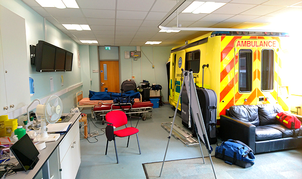 Equipment and an ambulance in a room