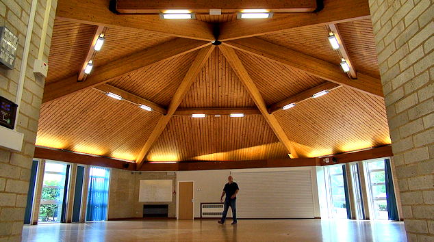 Wide shot of Dance Studio interior with man walking