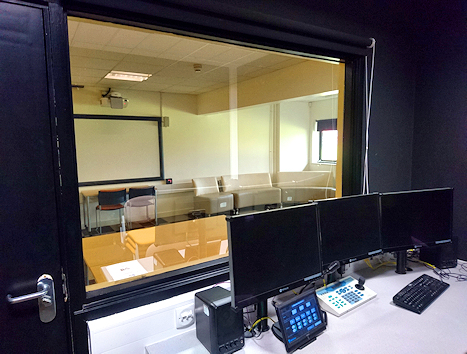 Looking through to teaching room from an observation / control room